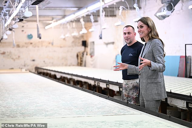 Pictured: The Princess of Wales looking at a screen print during a visit to Marina Mill in Cuxton today