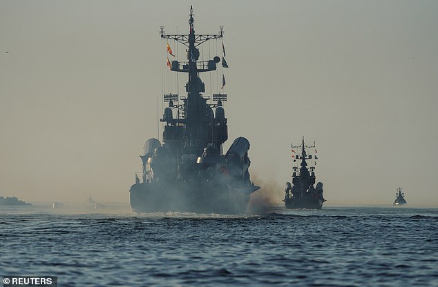 Russian warships leave a port during naval drills during the Zapad-2021 drills