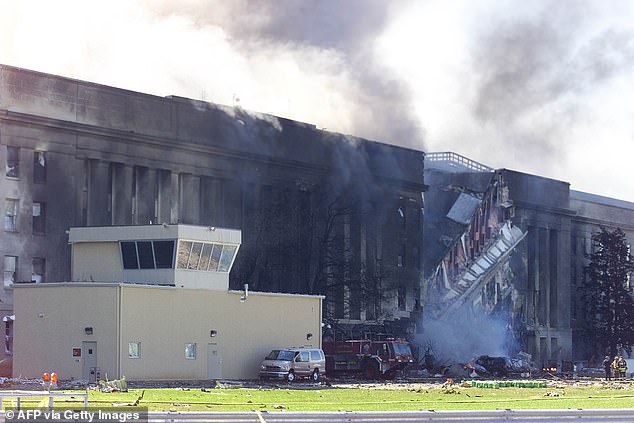 Smoke billows from the Pentagon after one of the four planes crashed into it on September 11