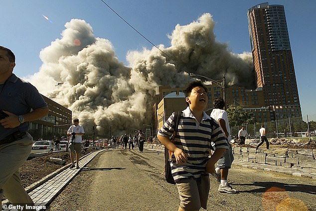 People run away as the North Tower of World Trade Center collapses on 9/11