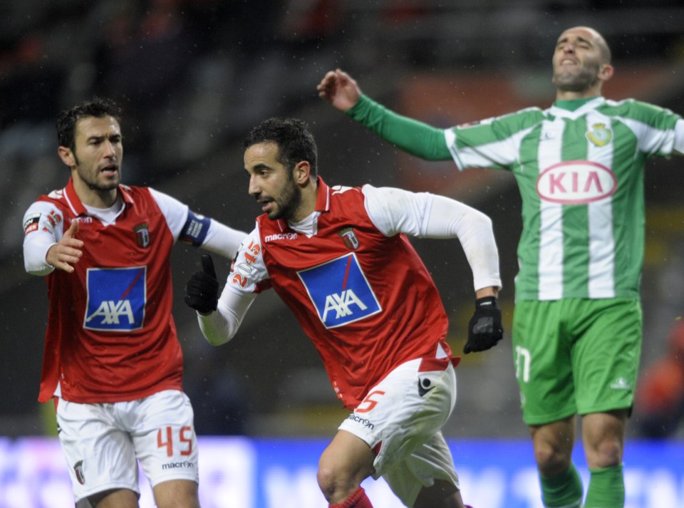 Soccer players celebrating a goal.