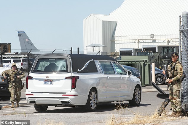 A hearse carrying the body of Charlie Kirk, 31, is seen arriving at the Roland R Wright Air National Guard Base on September 11 in Salt Lake City