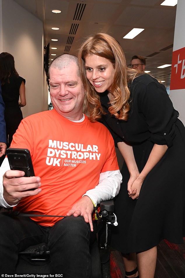 In one sweet moment, Princess Beatrice smiled for a selfie with an ambassador for the not-for-profit organisation that raises awareness about muscle wasting and weakening conditions - while supporting those affected