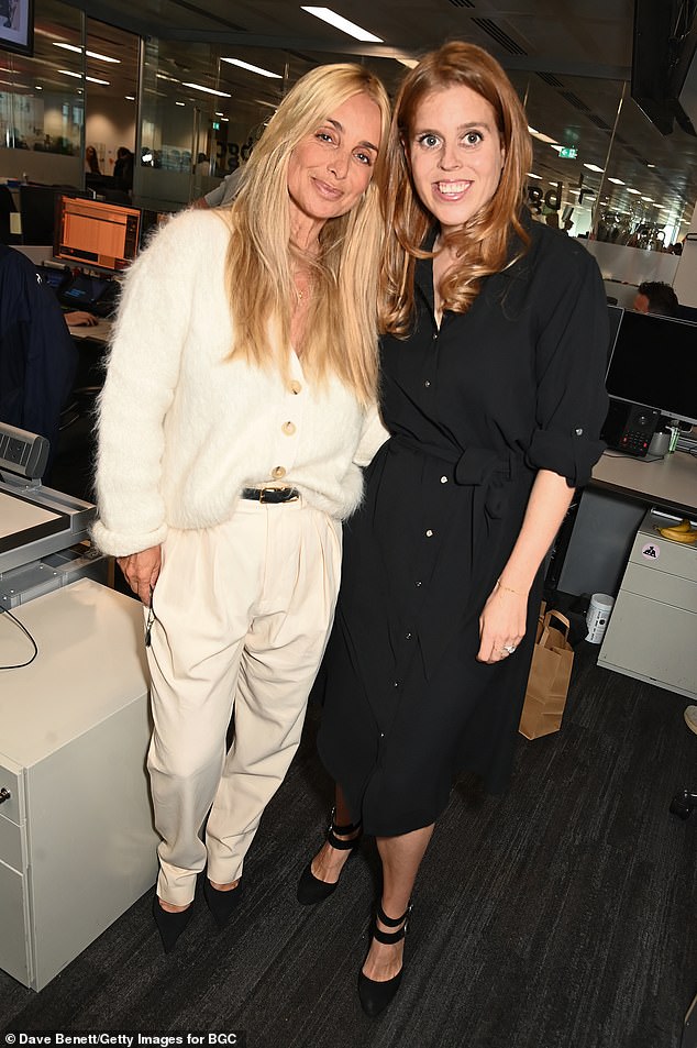 She also stopped to pose for a picture with Louise, 50, who was dressed in an all-white ensemble that perfectly offset Beatrice's dark, monochomatic outfit