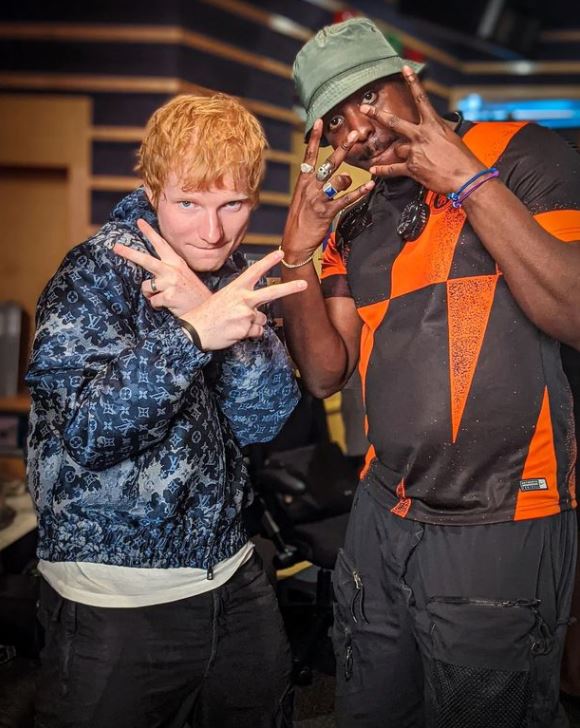 Ed Sheeran and Jamal Edwards posing together.