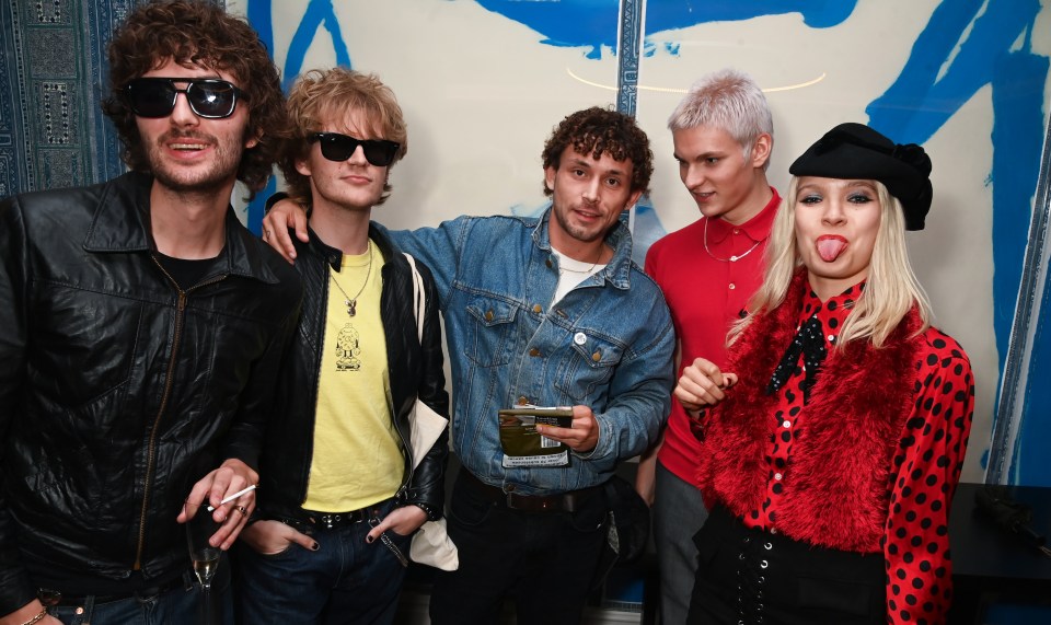 Group photo of five people at a film screening.