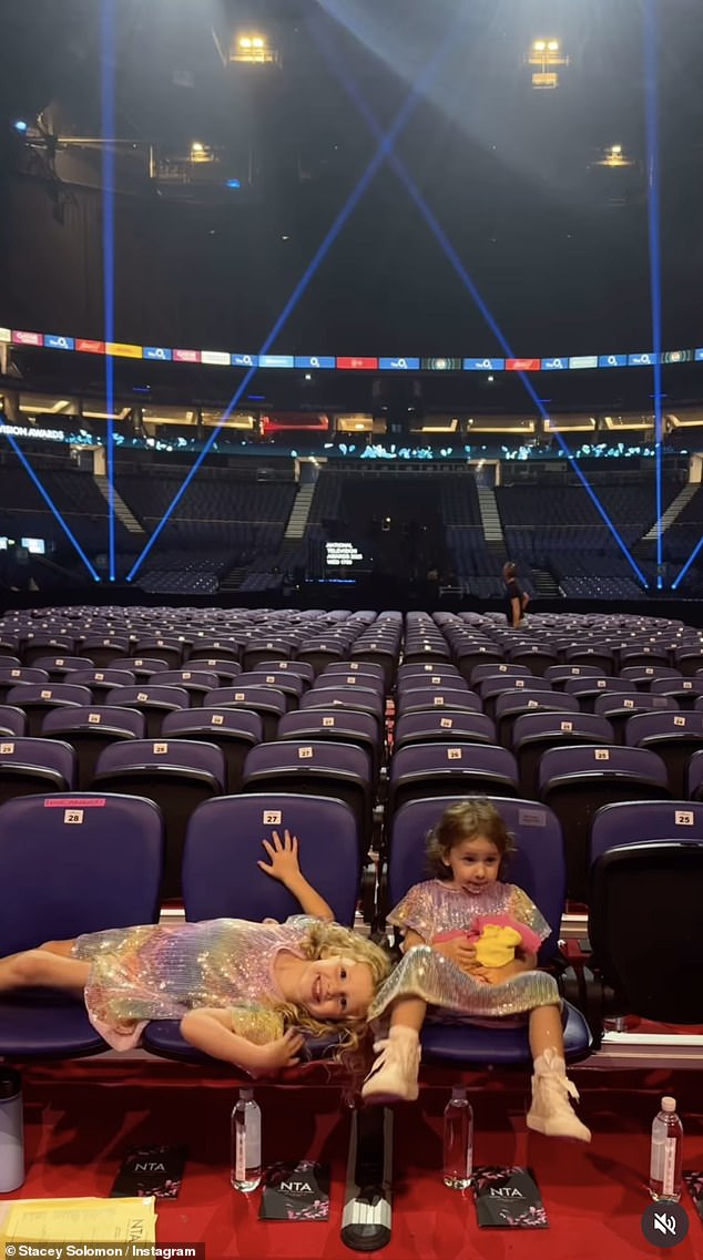 While her two little girls stole hearts in matching rainbow sequin dresses as they took a turn speaking into the microphone on stage and walking the red carpet