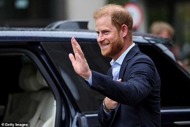 Prince Harry, Duke of Sussex waves as he departs following a visit to the Centre for Blast Injury Studies at Imperial College London yesterday