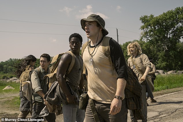 David Jonsson and Cooper Hoffman, centre, are pictured in a scene from The Long Walk