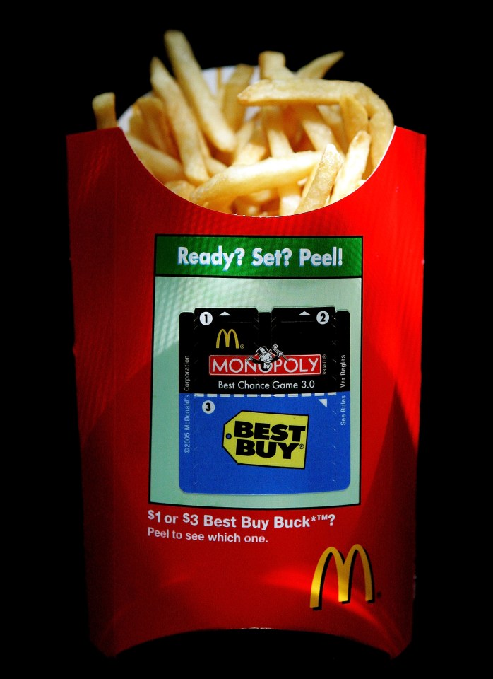 McDonald's french fries with Monopoly game pieces.