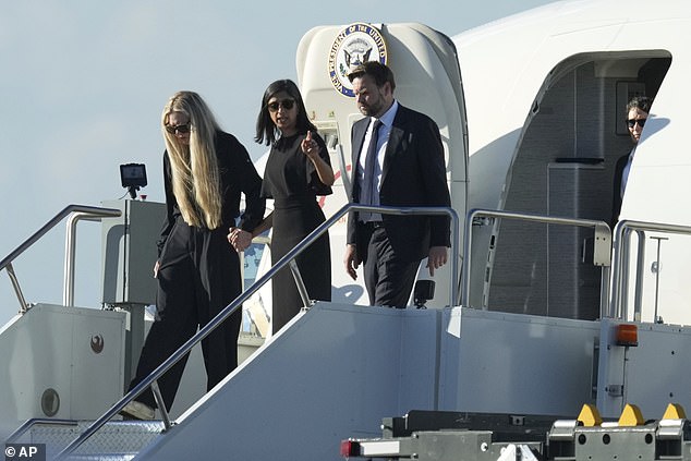 The Second Lady then pointed into the distance before moving her hand to meet Erika's