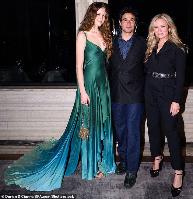 She was decked out in the custom Starbucks Siren Gown designed by Zac Posen (center) and celebrity stylist Erin Walsh (right), inspired by the coffee brand's logo