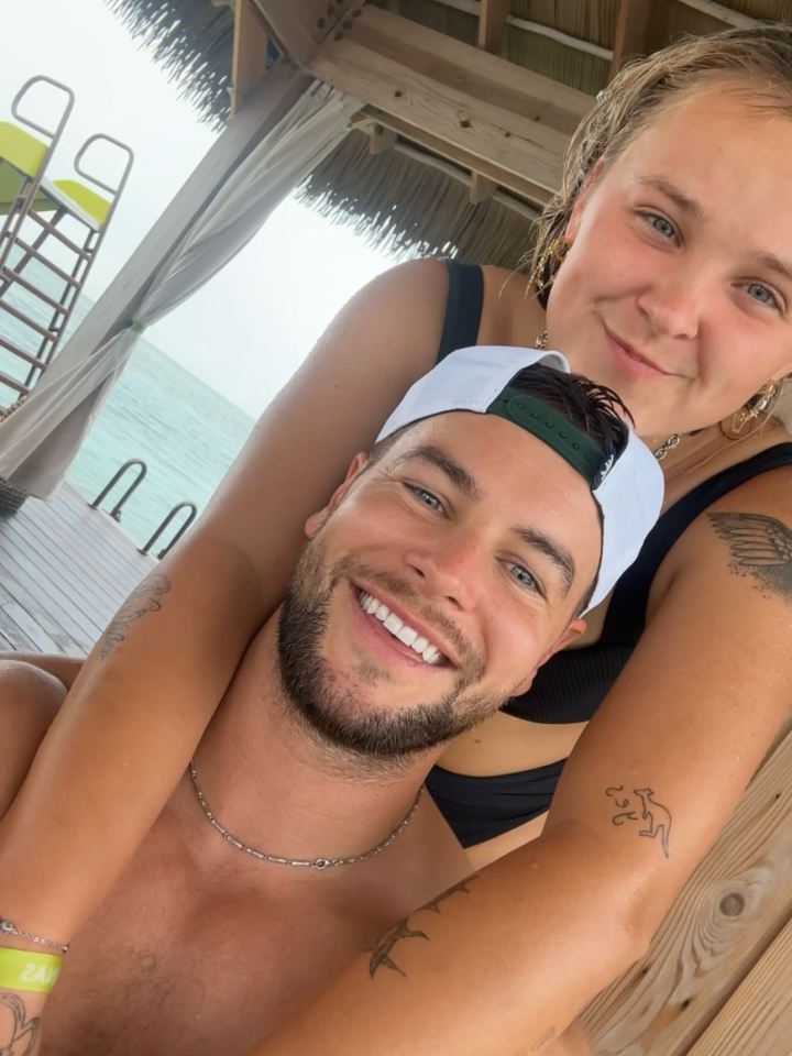 Jojo Siwa and Chris in a close embrace.