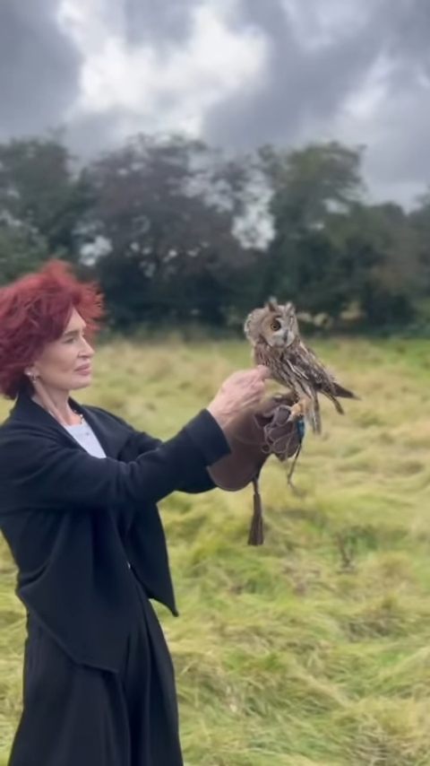 Sharon Osbourne holding an owl.