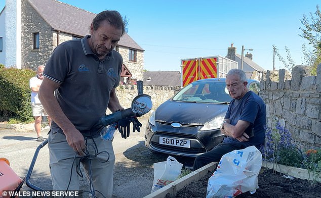 Hodgson attempted to destroy the wooden planter by cutting it up with an angle grinder
