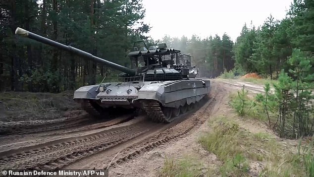 A Russian tank takes part in the drills near NATO's eastern border during Zapad 2025 drills