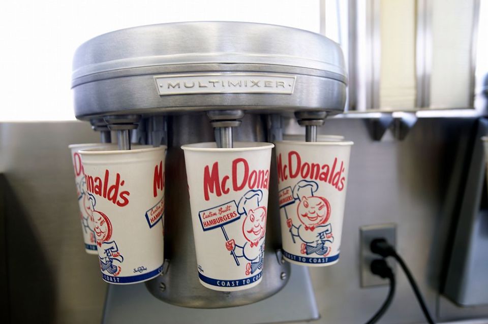 Multimixer milkshake machine with McDonald's cups.