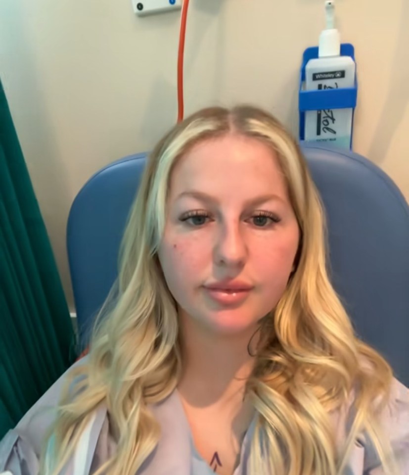 Woman in hospital gown.