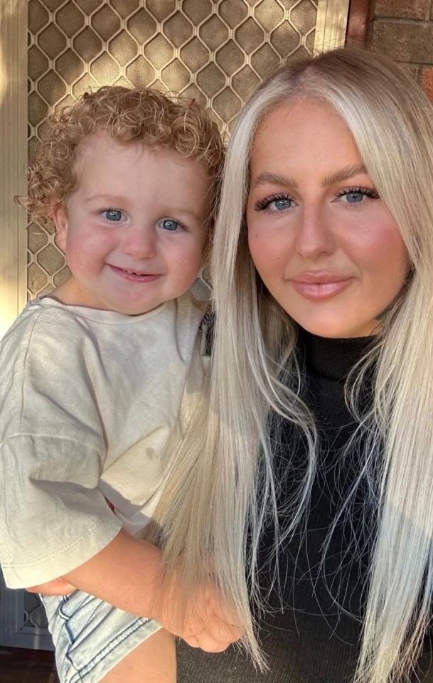 Photo of a mother holding her young son.