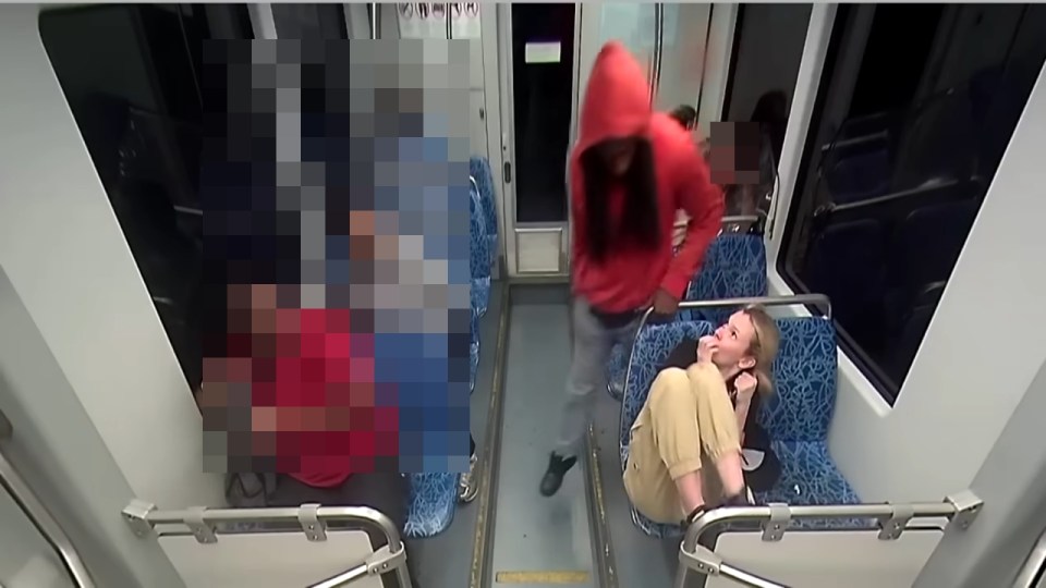 Surveillance image of a stabbing on a public transit vehicle.