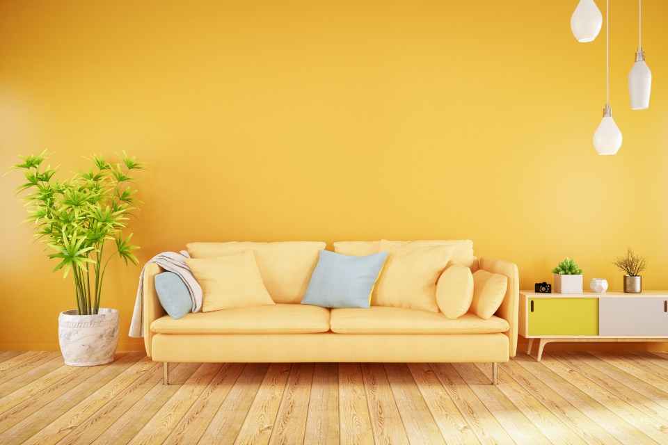 Illustration of a modern living room with a yellow sofa.