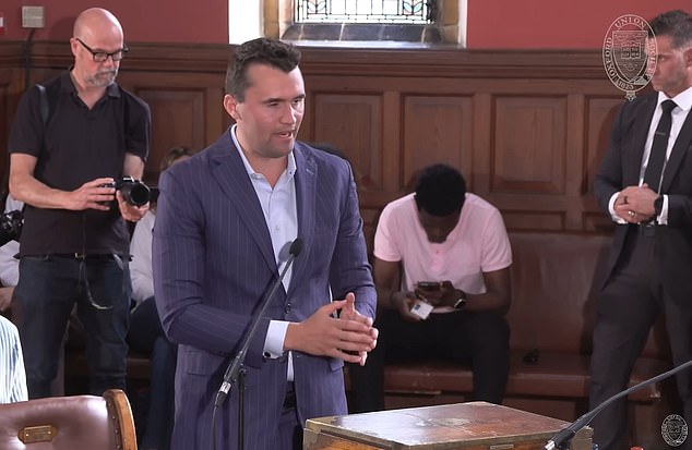 Charlie Kirk speaks to Abaraonye during a debate on 'toxic masculinity' at the Oxford Union