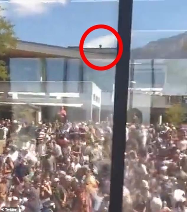 Charlie Kirk's assassin was dressed 'all in black, long pants, black bag, aviator-style sunglasses with a long gun' as he opened fire from the roof of a Utah Valley University campus building, chilling dispatch audio reveals