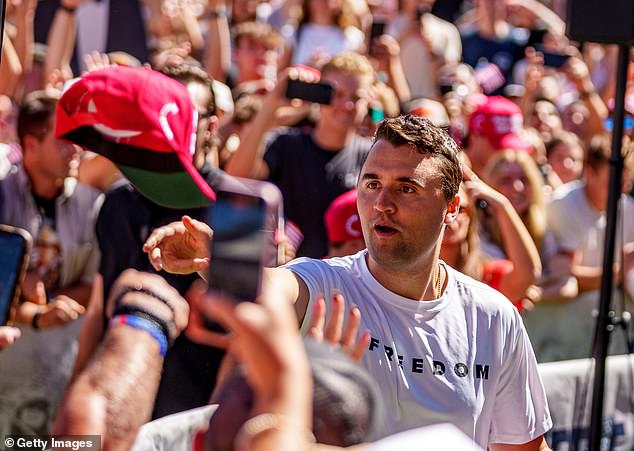 Kirk is seen here throwing hats to supporters who had gathered at Utah Valley University on Wednesday