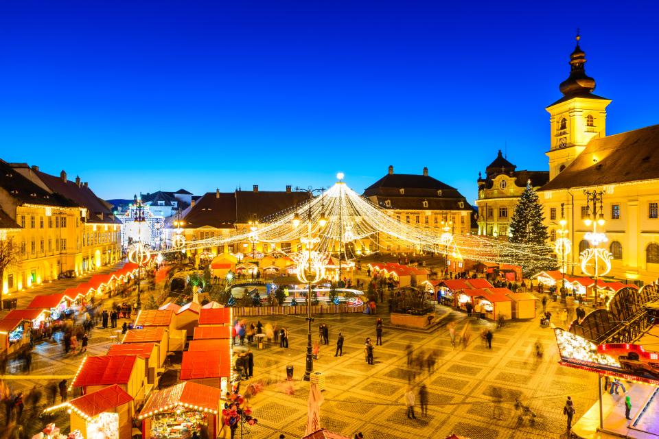 Night view of a Christmas market in Sibiu, Romania.