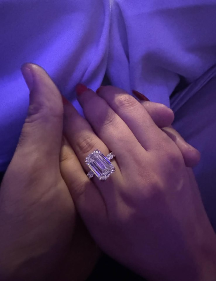 Engagement ring with large emerald-cut diamond.