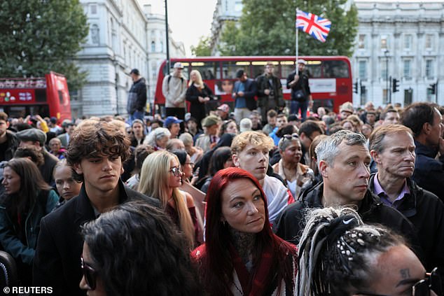 People attend a vigil near the Montgomery Statue in Whitehall, to commemorate U.S. conservative activist Charlie Kirk, who was fatally shot while speaking at an event at Utah Valley University, in London, Britain, September 12, 2025.