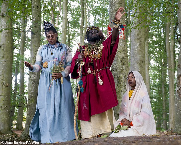 King Atehene and Queen Nandi with their handmaiden Asnat, seated