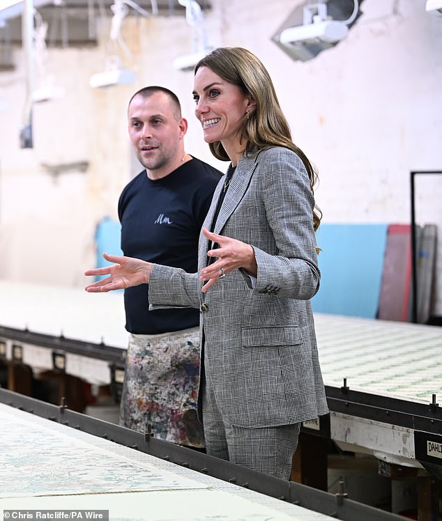 Pictured: The Princess of Wales looking at a screen print during a visit to Marina Mill in Cuxton yesterday