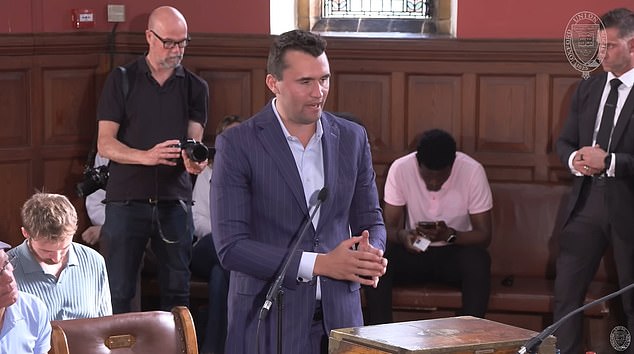 Charlie Kirk speaks to Abaraonye during a debate on 'toxic masculinity' at the Oxford Union