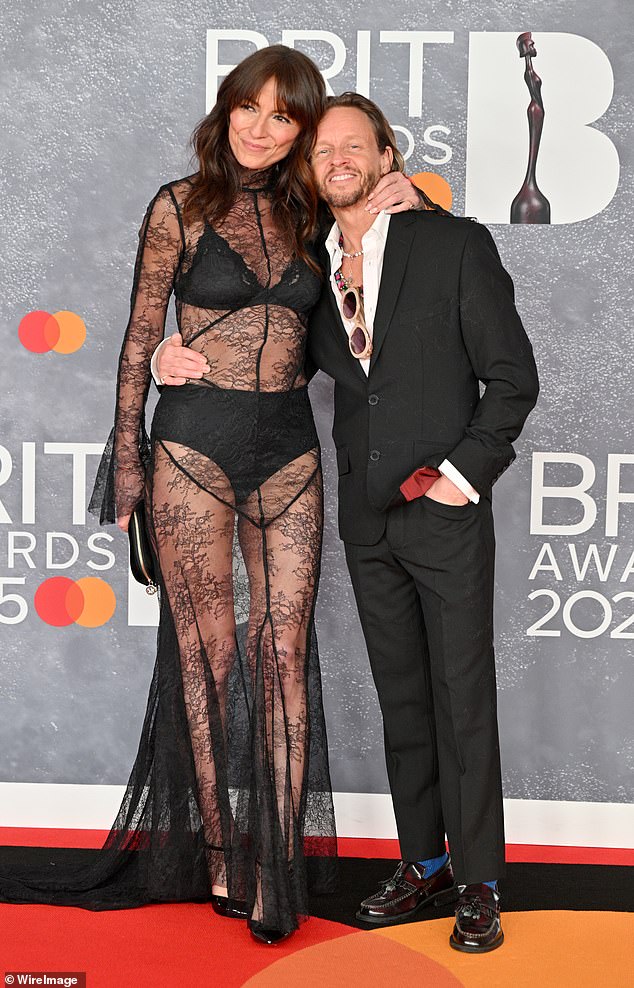 Revealing her engagement, a friend of Davina's said: 'She has a ring but is only wearing it in private' (pictured with Michael in March)