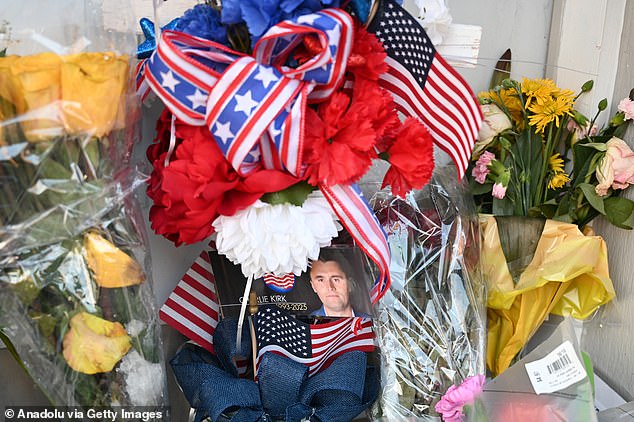 Mourners lay flowers and light candles in a heartfelt vigil outside the Turning Point USA Legacy Center on September 11, 2025 in Lemont, the organization's original headquarters established in 2012 by founder Charlie Kirk, one day after the conservative activist was fatally shot at an event in Utah