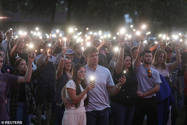 People attend a vigil at Orem City Center Park, after U.S. right-wing activist and commentator, Charlie Kirk