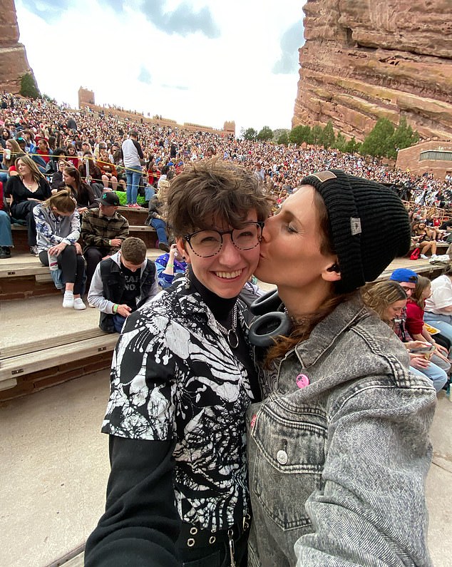 Wolfe, pictured with partner in 2024, became the first openly transgender athlete to qualify for the Olympics for the United States back in 2021 at the Tokyo games