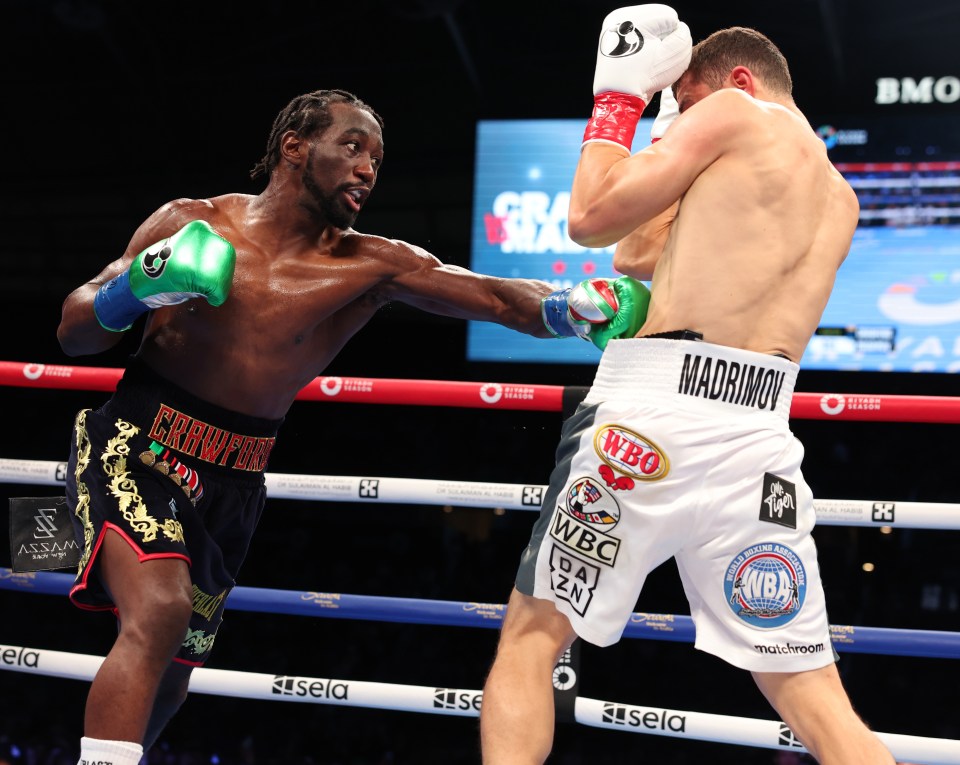 Terence Crawford (black shorts) boxing Israil Madrimov (white shorts).