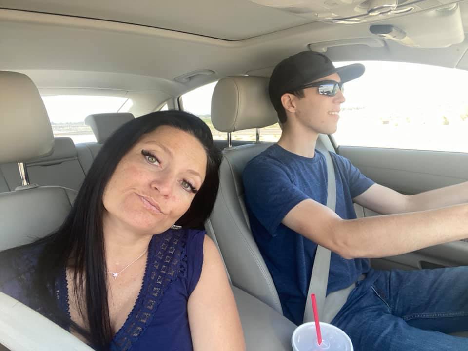 Woman and young man in a car.