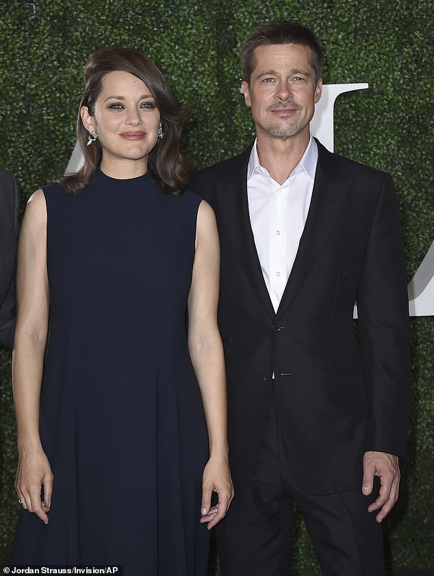 Brad Pitt with Cotillard at the premiere of Allied in 2016. Boshoff writes: 'One Hollywood source, who had a ringside seat on the disintegration of Pitt and Jolie's marriage in 2016, tells me that Pitt "would rave about Marion's French elegance and style"'