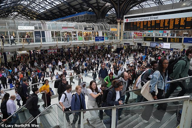 Passengers inside London Liverpool Street station as the Underground strike brought transport to a halt