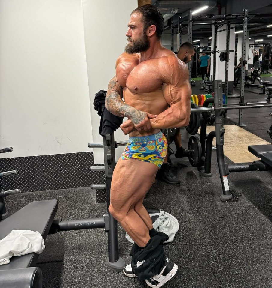 Bodybuilder posing in a gym.