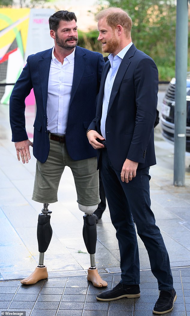 Pictured: David Henson and Prince Harry during their visit to the Centre For Blast Injury Studies at Imperial College London