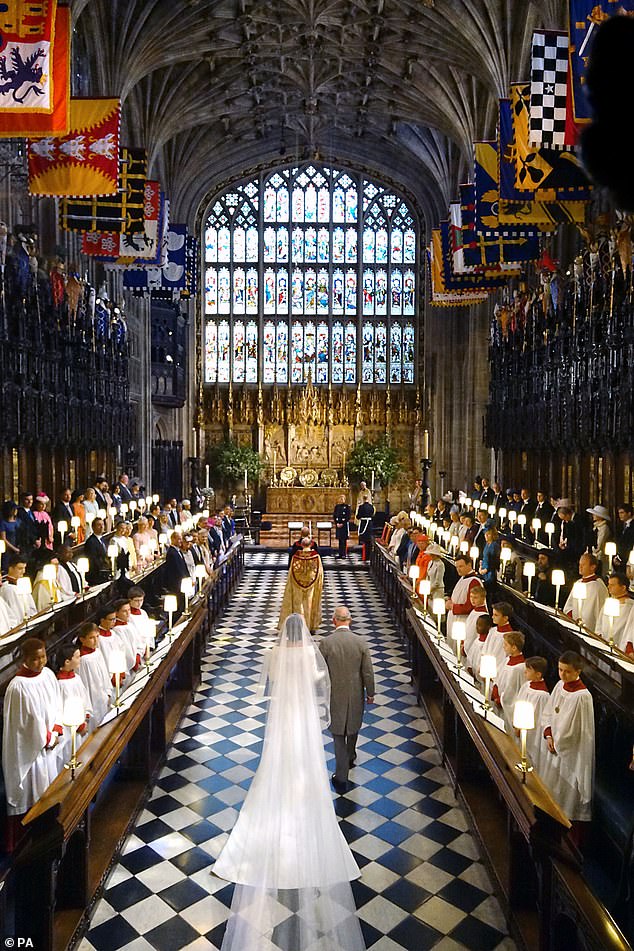 Charles released a statement saying he was 'pleased to welcome her to the Royal Family in this way'. Pictured: The Prince of Wales walks Meghan Markle down the aisle for her wedding to Prince Harry on May 19, 2018