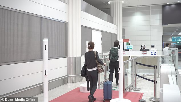 The passage (pictured), launched at Dubai International Airport last month, instead uses artificial intelligence, biometric cameras and flight data to automatically recognise customers - and any dodgy-looking luggage