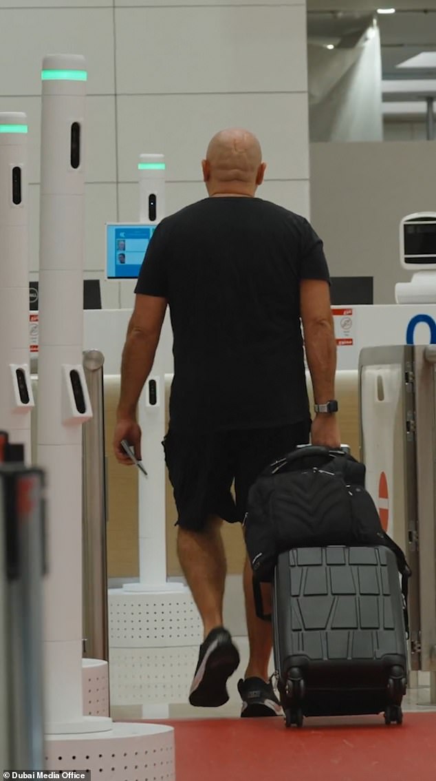 Brigadier Walid Ahmed Saeed, assistant deputy director at GDRFA Dubai, said: 'Just by walking through this corridor, you have completed your exit'. Pictured: The new system
