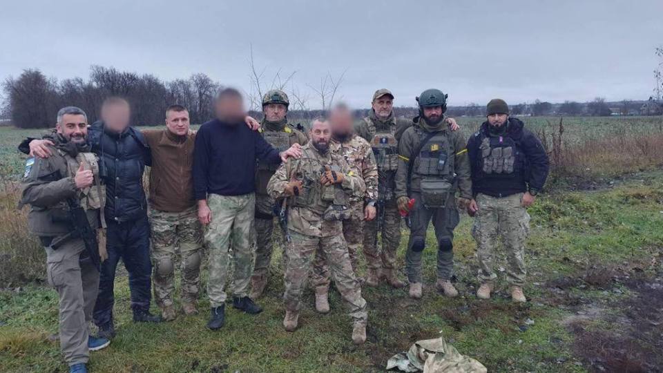 Photo of Ukrainian soldiers, some faces blurred.
