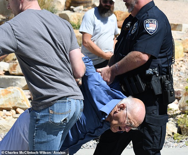 In the chaotic aftermath of the assassination, 71-year-old George Zinn (pictured) was cuffed and hauled away by police at the scene - but was soon released as the manhunt frantically continued