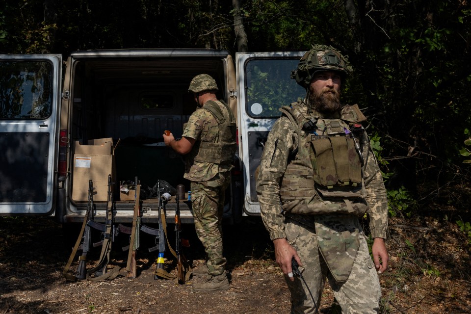 Ukrainian soldiers preparing for drone defense training.